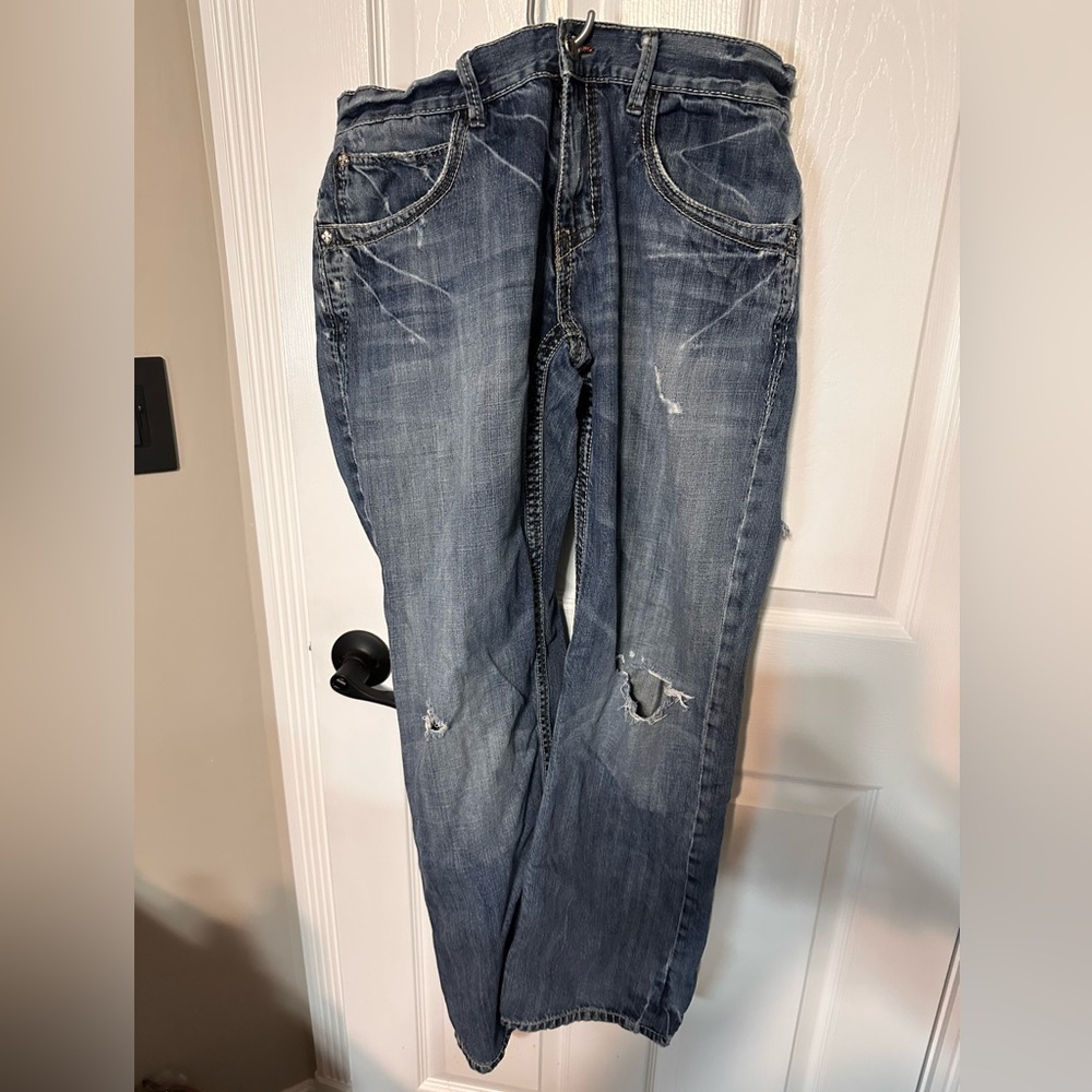 Buckle Manchester Jeans 34R with Holes in Both Knees and on the Back of One Leg.